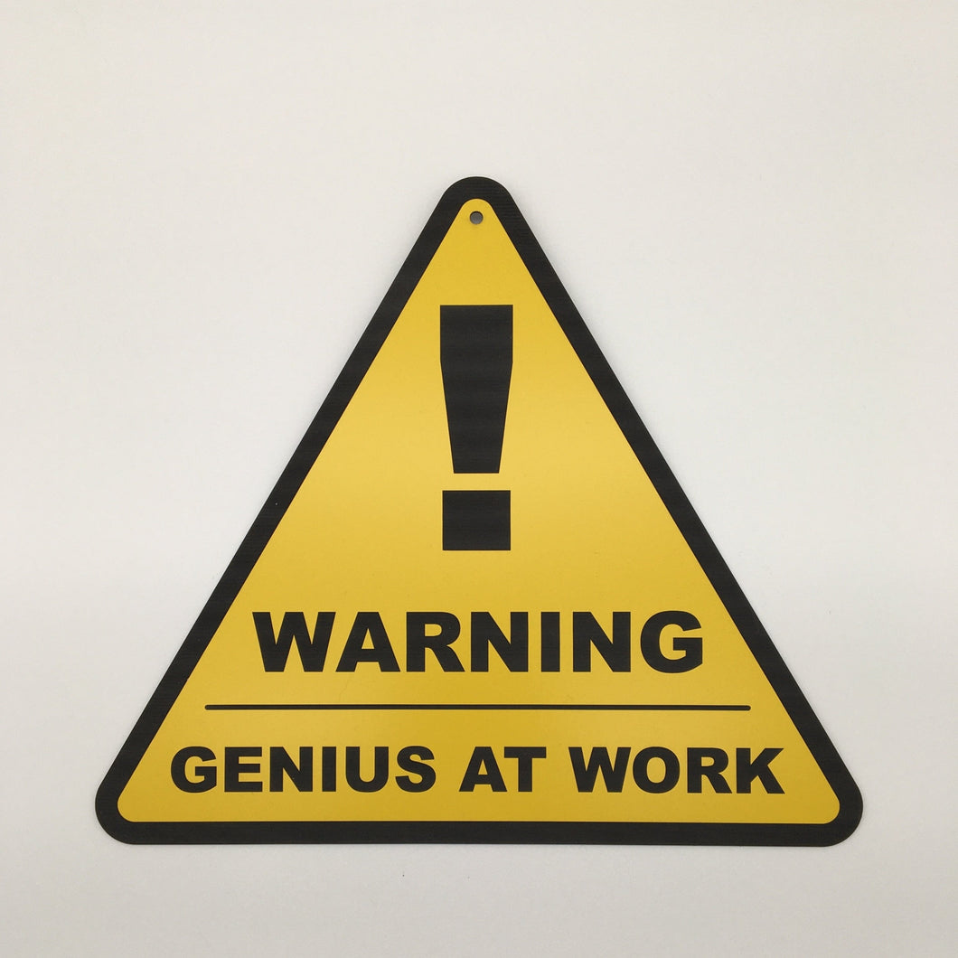 Warning sign 'Genius at work'